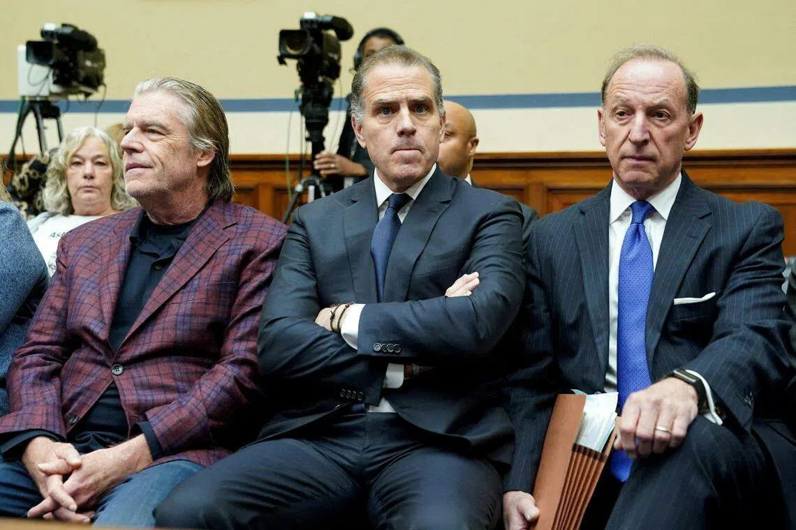 Hunter Biden, son of US President Joe Biden, sits with his attorney Abbe Lowell as he makes a surprise appearance at a House Oversight Committee meeting to vote on whether to hold Biden in contempt of Congress for failing to respond to a request to testify to the House last month, on Capitol Hill in Washington, Jan 10, 2024.   