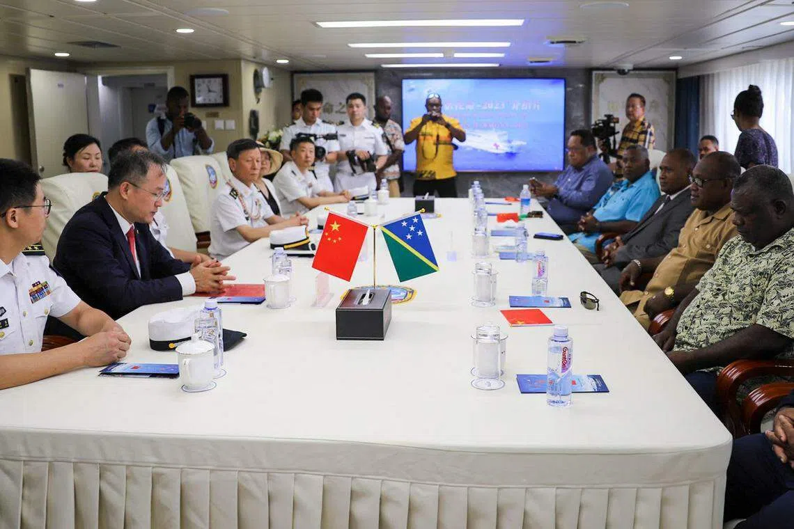 China's ambassador to Solomon Islands Li Ming (left) sits with officials aboard a Chinese naval hospital ship after it arrived into Honiara, Solomon Islands on Aug 19, 2023. Solomon Islands and Kiribati both severed diplomatic links with Taiwan in September 2019, switching to Beijing in the wake of a sustained charm offensive.
