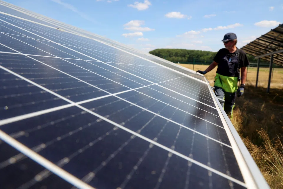 A technician checks a solar panel at the Weesow-Willmersdorf solar park in Werneuchen, Germany. Europe has been trying to strike a balance between weaning itself off Russian gas and continuing to push ahead with plans to decarbonise energy.