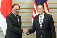 Japan Prime Minister Fumio Kishida (right) with Malaysia Prime Minister Anwar Ibrahim at the Tokyo summit marking 50 years of ties between Japan and Asean. Japan will provide equipment such as rescue boats and supplies under an official security assistance deal, signed by the two countries’ foreign ministers.