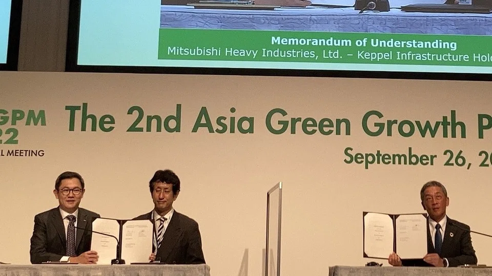 Keppel Infrastructure executive director Chua Yong Hwee and Mitsubishi Heavy Industries GTCC business division general manager of international sales and marketing Takao Tsukui at the signing of a memorandum of understanding to explore the adoption of an ammonia-fired gas turbine on Jurong Island. 