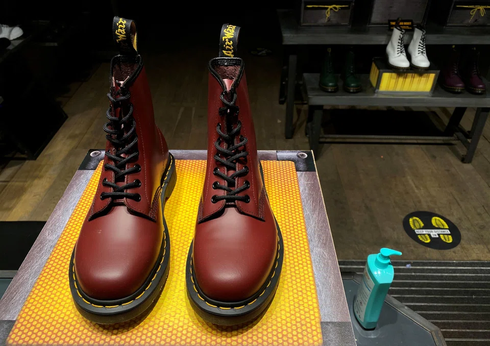 A pair of Dr Martens boots. The company flagged problems in its Los Angeles distribution centre. Demand during the Christmas shopping season had also been lower than expected.  