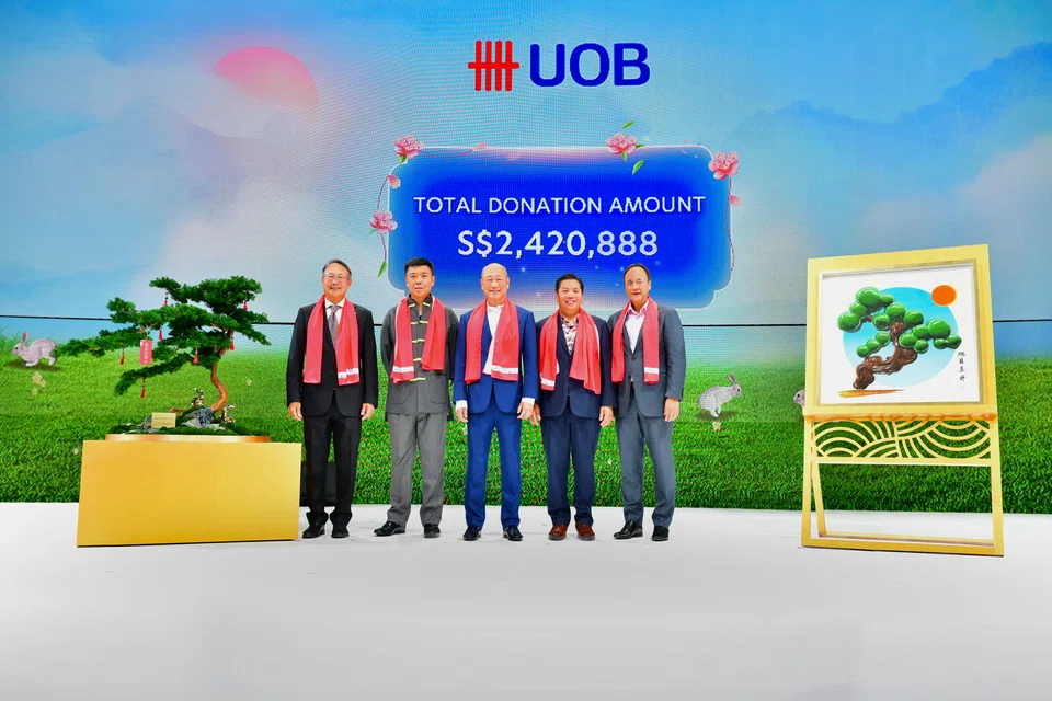 From left: UOB head of group commercial banking Eric Lian; one of the winning bidders, Kelvin Lim; UOB CEO Wee Ee Cheong; another winning bidder, Neo Kah Kiat; head of group wholesale banking and markets Frederick Chin at the Chinese New Year event on Jan 26.