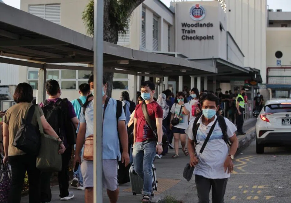 Travellers arriving from Malaysia at Woodlands Train Checkpoint on May 3. With the loosening of border curbs, Singapore has seen overall job postings and Malaysian job applicant numbers rise, according to data from job portal FastJobs. 