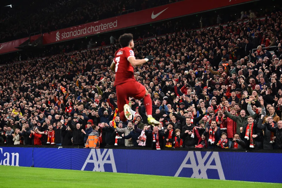 Liverpool supporters cheer after Luis Diaz scored against Luton Town in the English Premier League match on Wednesday night. The Reds won 4-1. 