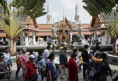Chinese tourists at a Bangkok temple. The increase in travellers provides a welcome relief to countries whose tourism industries rely on the Chinese and their spending for growth.
