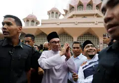 “There is no way I can succeed if the backbone of the civil service is not with me,” said Anwar, who was speaking in soft tones that were a marked departure from his fiery campaign speeches.