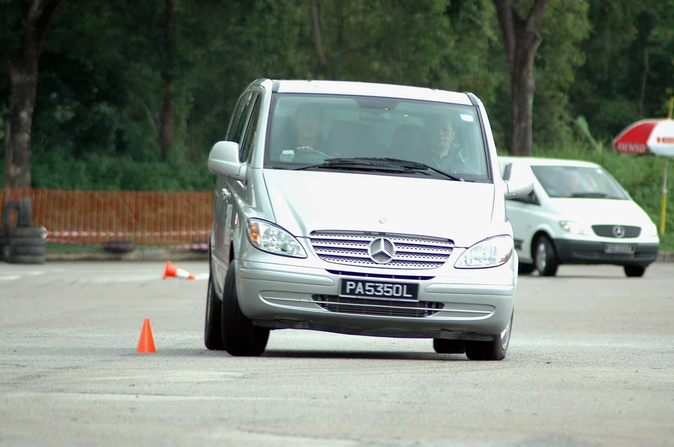 The driver of a Mercedes-Benz van being put through a defensive-driving course conducted by DaimlerChrysler in Singapore. 