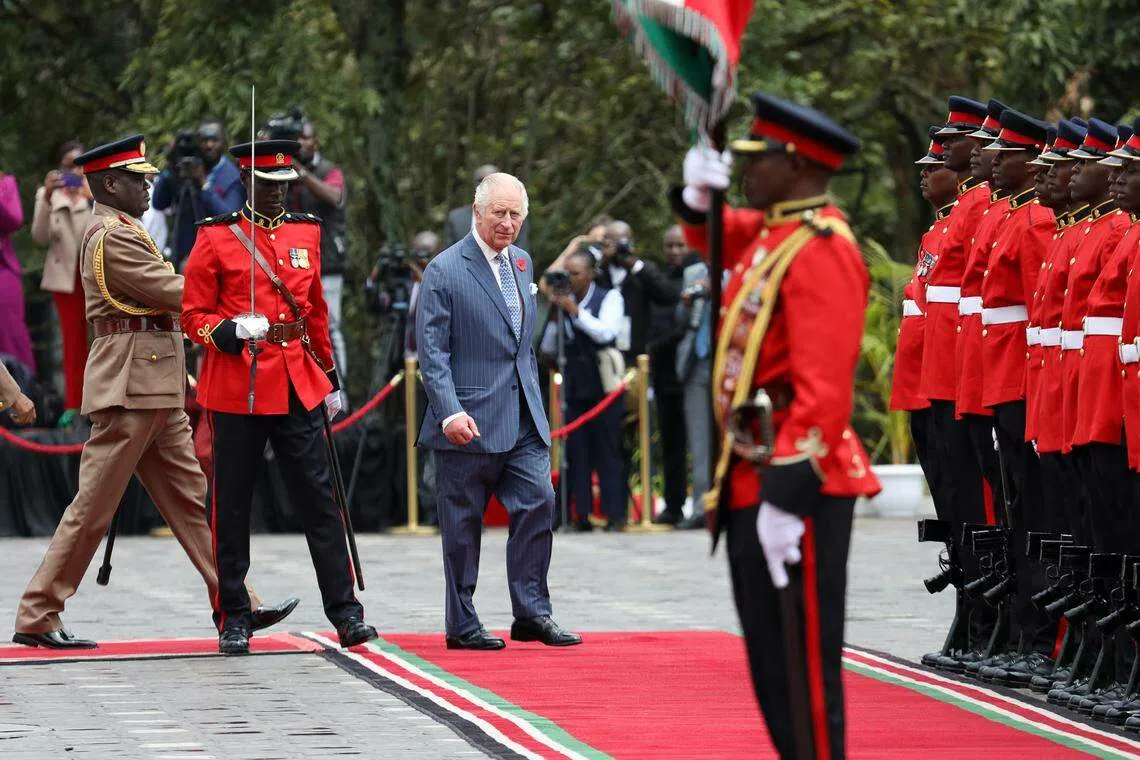 Britain's King Charles III (centre) inspects the guard of honor upon his arrival at the Statehouse in Nairobi, Kenya, on Oct 31. His four-day trip has been billed as an opportunity to look to the future and build on the cordial modern-day ties between London and Nairobi.