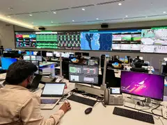 Staff work on March 28, 2022 at the Aspire security command centre for the Fifa World Cup Qatar 2022, near Khalifa International stadium in Doha, where operation and security teams will be able to monitor all the stadiums during the World Cup. 