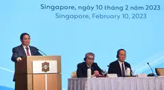From left: Vietnam Prime Minister Pham Minh Chinh speaking at the Vietnam Singapore Business Forum; Lim Ming Yan, chairman of the Singapore Business Federation and Tan See Leng, Second Minister for Trade and Industry.