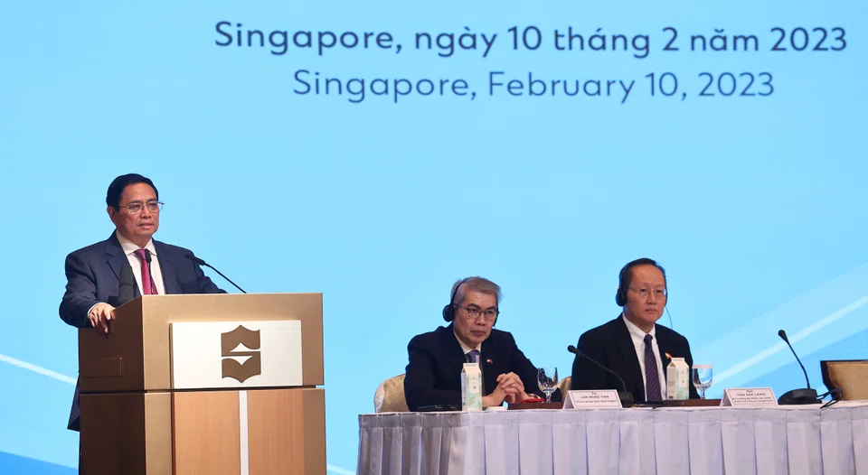 From left: Vietnam Prime Minister Pham Minh Chinh speaking at the Vietnam Singapore Business Forum; Lim Ming Yan, chairman of the Singapore Business Federation and Tan See Leng, Second Minister for Trade and Industry.