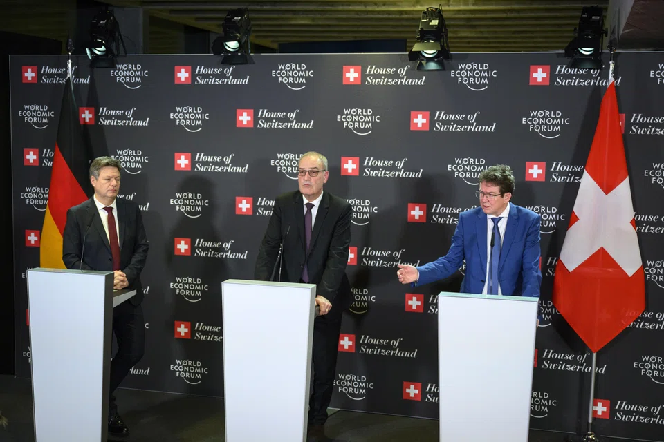 (From left) Germany's Robert Habeck, vice-chancellor and Federal minister for economy and climate, Switzerland's Economy Minister Guy Parmelin and Switzerland's Transport, Environment, Energy and Communications Minister Albert Roesti speak during a press conference on the sideline of the World Economic Forum, Davos, Switzerland, Jan 16, 2023. 