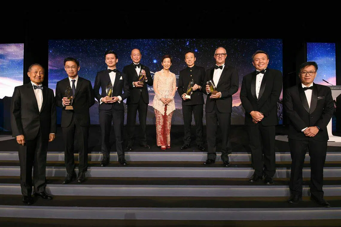 Honouring excellence: (from left) Stephen Lee, chairman of the SBA judging panel; Tan Hak Leh, regional chief executive, AIA Group,  representing Lee Yuan Siong, chief executive officer of AIA Group (Outstanding Overseas Executive of the Year); Ian Ang, co-founder and CEO, Secretlab SG (Young Business Leader of the Year); Wee Ee Cheong, deputy chairman & CEO, UOB (Businessman of the Year); guest­-of-­honour Minister for Sustainability and the Environment, Grace Fu; Lee Chee Koon, president & group CEO, CapitaLand Investment (Outstanding Chief Executive of the Year); Laurent Junique, founder and CEO of TDCX (The Enterprise Award); Christopher Ong, senior vice­-president & managing director, DHL Express Singapore; Wong Wei Kong, editor, The Business Times.