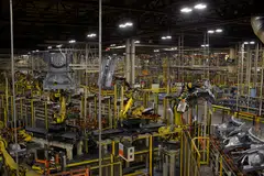Robotic arms bring together car frames for welding at Nissan Motor Co's manufacturing plant in Smyrna, Tennessee. An index of new orders shrank for a third-straight month to a more-than-two-year low, and a measure of international trade fell, illustrating softer demand as central bankers around the world ratchet up interest rates to fight inflation.