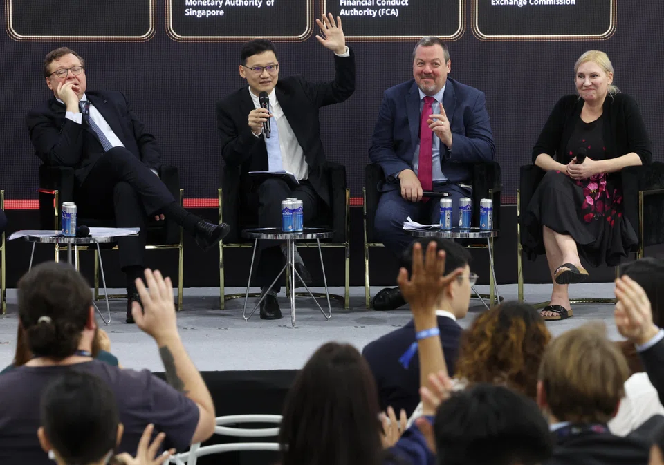 The Iosco panel discussion at the Singapore Fintech Festival. From left are Jean-Paul Servais, chair of the Iosco Board; Lim Tuang Lee, MAS assistant MD for  capital markets and chair of the Iosco Fintech Task Force; Matthew Long, director of payments and digital assets, Financial Conduct Authority; and Valerie Szczepanik, director of FinHub at the US SEC. 