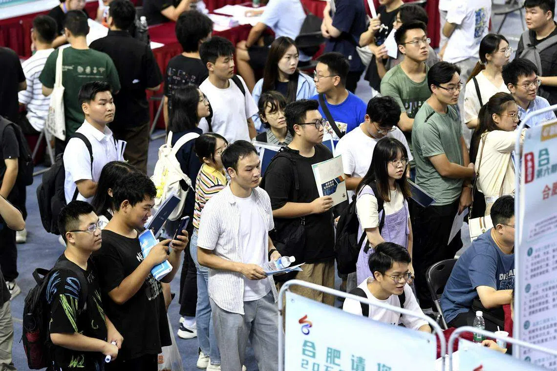 University graduates attend a job fair in Hefei, Anhui province, China, Sept 4, 2023. On Wednesday, China's statistics bureau is expected to omit for the fourth consecutive month the release of youth unemployment data, suspended in July after reaching a record 21.3 per cent in June, just as 11.6 million fresh graduates were entering the job market.