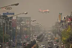 A plane descends towards Chiang Mai International Airport amid high levels of air pollution in Chiang Mai, Thailand, April 10, 2023.