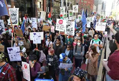 Protestors march down Market Street toward Moscone Centre in San Francisco where the Apec summit will be held. Demonstrators are protesting against capitalism with the aim to shut down the meeting.