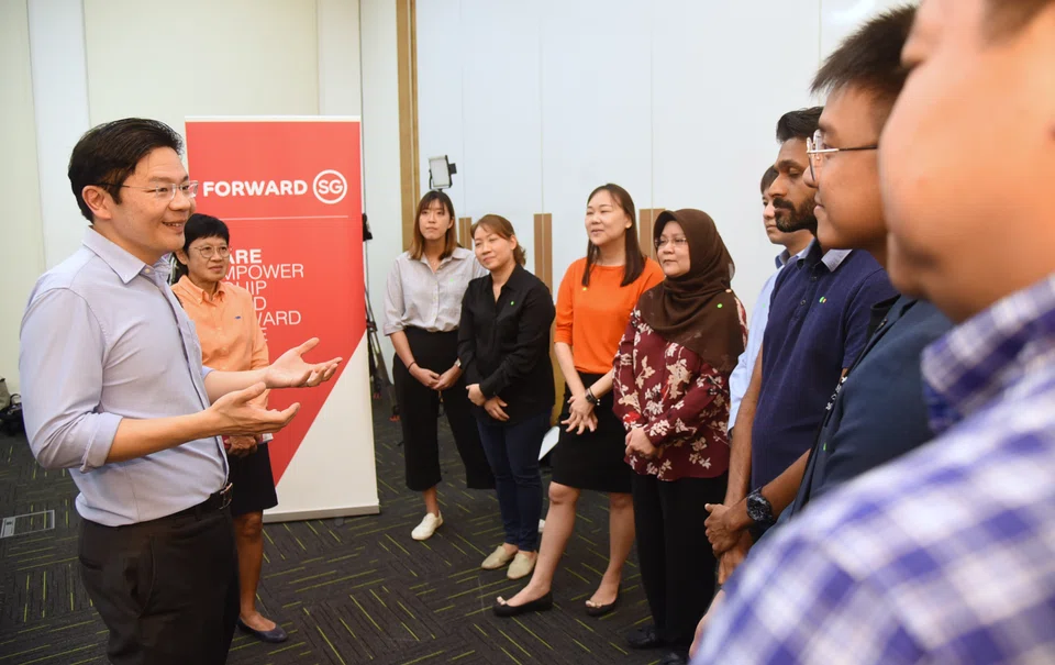 Deputy Prime Minister Lawrence Wong (extreme left), at a dialogue with social service practitioners, outlined his vision for a fairer and more inclusive society with better support for lower-income families, seniors and those starting and raising families.  