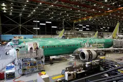 The FAA says Boeing could continue producing MAX jets at the current monthly rate, but it could not increase that rate. 