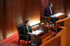 Hong Kong Chief Executive John Lee (left) delivers his annual policy address to the Legislative Council as President of the Legislative Council Andrew Leung (right) looks on in Hong Kong on Oct 25, 2023.