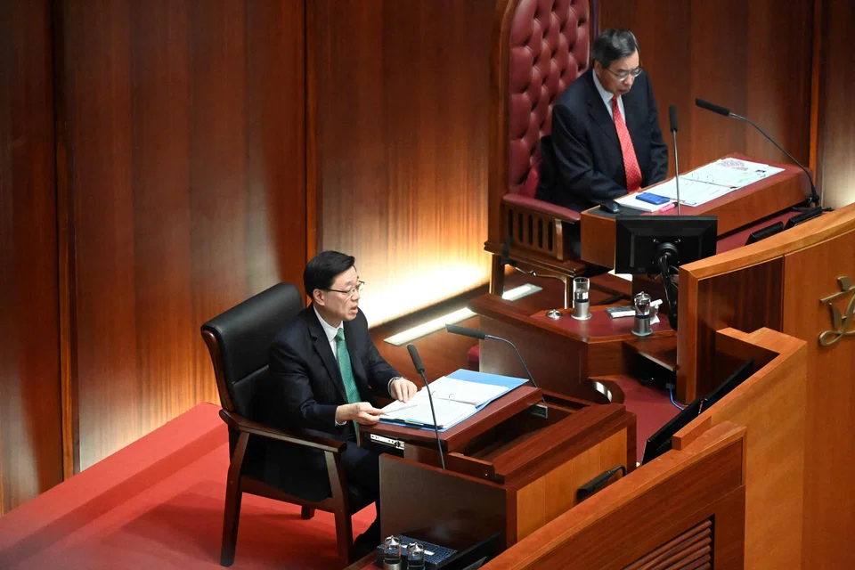 Hong Kong Chief Executive John Lee (left) delivers his annual policy address to the Legislative Council as President of the Legislative Council Andrew Leung (right) looks on in Hong Kong on Oct 25, 2023.