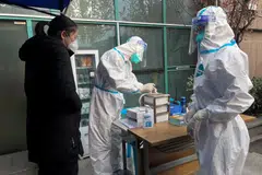 Several leading scientists and WHO advisers say it may be too early to declare the end of the Covid-19 pandemic emergency phase because of high levels of infections in China.