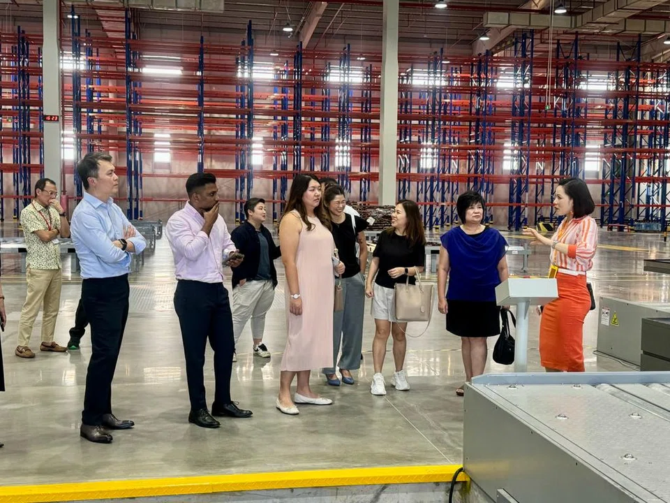 Representatives from Singapore businesses touring the YCH SuperPort, a warehouse facility located in Vietnam's northern province of Vinh Phuc. In the first 10 months of 2023, investors from Singapore poured some US$4.65 billion into Vietnam.