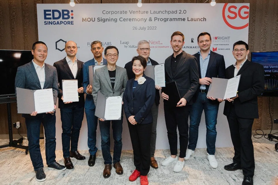 Representatives from the appointed venture studios – BCG Digital Ventures; FutureLabs Ventures; Leap by McKinsey; Next by Bain & Company; Rainmaking; and Wright Partners (in partnership with Ming Labs), along with EDB managing director  Jacqueline Poh and executive vice-president Choo Heng Tong at the MOU signing of the Corporate Venture Launchpad 2.0 programme on July 26, 2022.  