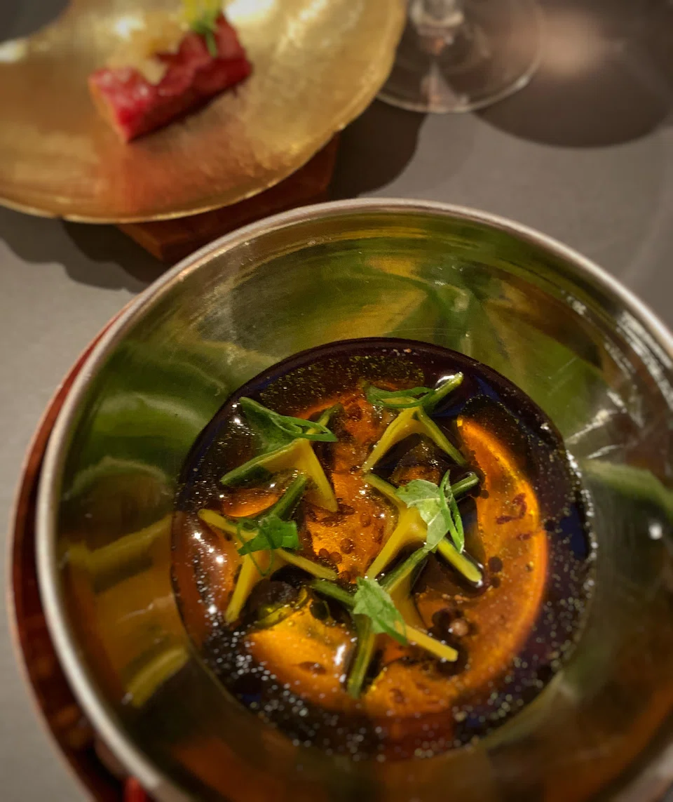 Dainty dumplings in spicy beef consomme in 'Barbarian's Head'.