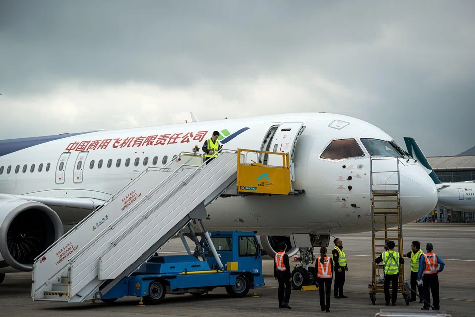 A Commercial Aircraft Corp of China (Comac) C919 aircraft makes its overseas debut at Hong Kong International Airport in Hong Kong, Dec 13, 2023. 