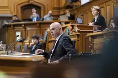 Swiss Federal Council President Alain Berset at the extraordinary session of the Federal Assembly convened to debate the government's decisions to rescue Credit Suisse and its takeover by UBS.  