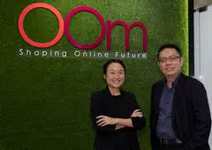 Oom chief executive officer Cheow Yu Yuan (right) says that career conversion programmes have enabled the company to hire mid-career switchers such as Ng Jia Min, who is now assistant team lead of search engine optimisation.