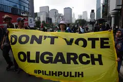 Activists at a rally in Indonesia. The key to defang identity politics is to transmit a fundamental message to voters: the government is working for you, not for elites of some kind or for friends in the party establishment.