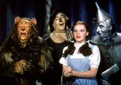 The sequined shoes are associated with the character Dorothy clicking them together and saying repeatedly, “there’s no place like home”. 