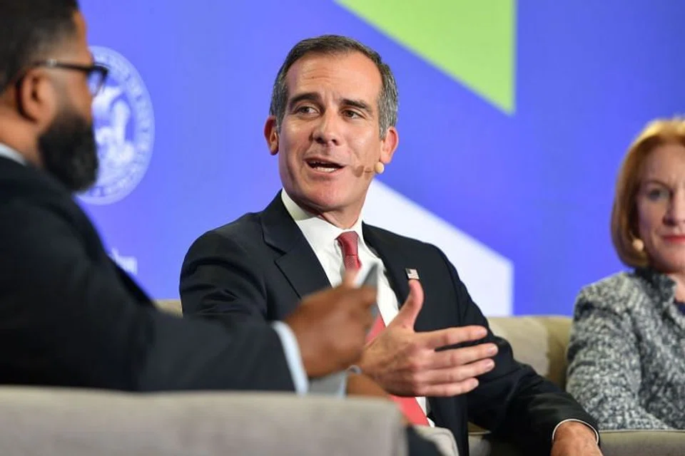 Workers stand near palm oil fruits inside a palm oil factory in Sepang, outside Kuala Lumpur.