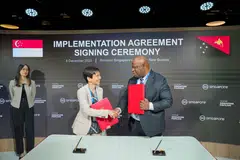 Minister for Sustainability and the Environment Grace Fu and Papua New Guinea Minister of Environment, Conservation and Climate Change Simo Kilepa at a ceremony at COP28 in August 2023 launching Singapore's cooperation with over 20 countries to create a supply of carbon credits.