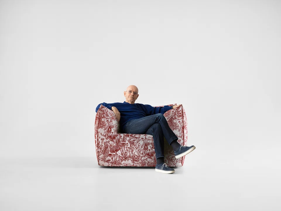Mario Bellini on an armchair from the Stella McCartney x B&B Italia capsule collection.