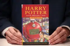 A rare first edition and signed by the author copy of 'Harry Potter and the Philosophers Stone' by British author J K  Rowling, which is to be put up for auction at Christie's auction house in London. 