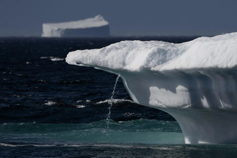Flowing water from a melting iceberg in Scoresby Fjord, Greenland, August 12, 2023. Since 1990, melting ice in Greenland and Antarctica has slowed down the Earth’s rotation, a study found. This has delayed the need for a negative leap second until at least 2029.