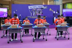 Students from APSN Chaoyang School showcase their musical talents with a performance of Home by Kit Chan at the appreciation dinner for Singtel's annual charity golf fundraiser.