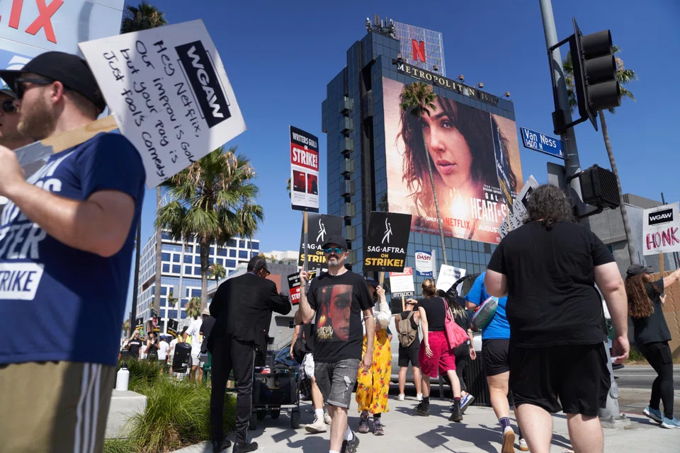 Members of the Writers Guild of America and Screen Actors Guild - American Federation of Television and Radio Artists picketing in front of the Netflix headquarters in Los Angeles on Aug 14. 