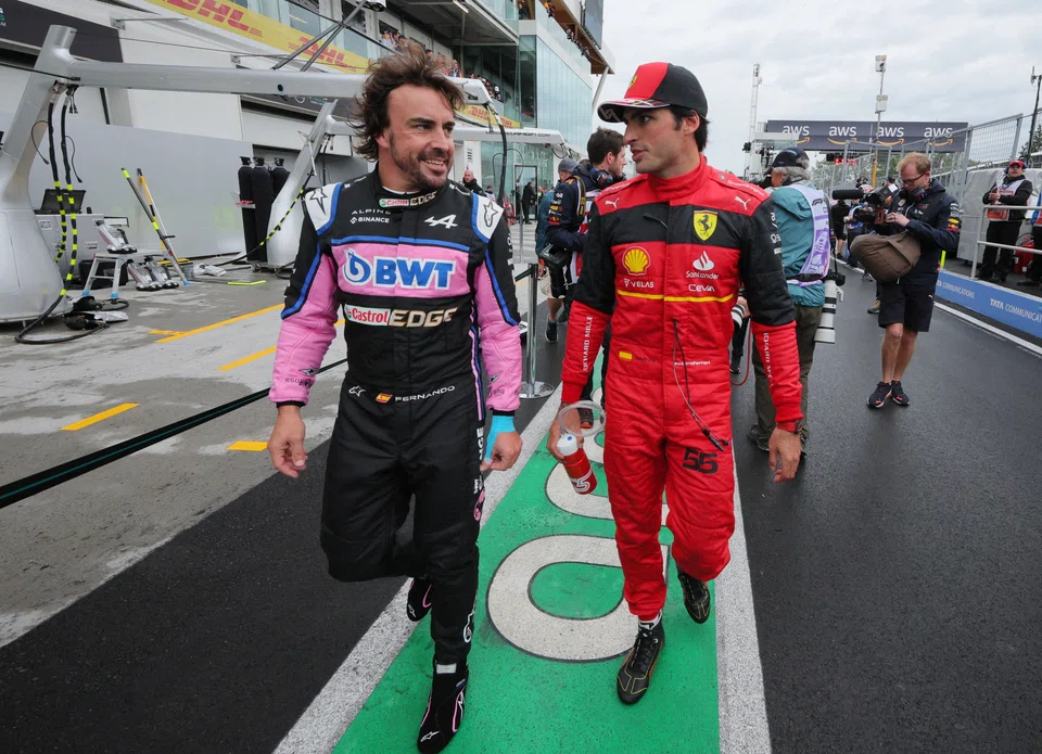 The Alpine team's Fernando Alonso (left) placed second at the Formula One F1 race in Montreal, Canada.  He has signed a multi-year contract with Aston Martin. 