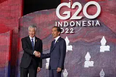 Prime Minister Lee Hsien Loong (left) is welcomed by Indonesian President Joko Widodo at the start of the G20 Summit in Nusa Dua, Bali on Nov 15, 2022.