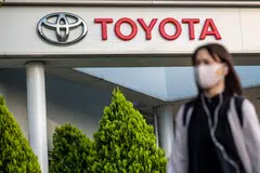 Toyota on Wednesday reported fourth-quarter profit slumped by a third, as a sliding yen and solid demand failed to offset the impact of production disruptions.
