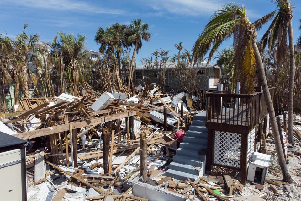 Remains of destroyed houses almost a month after Hurricane Ian made landfall in Fort Myers Beach in Florida.