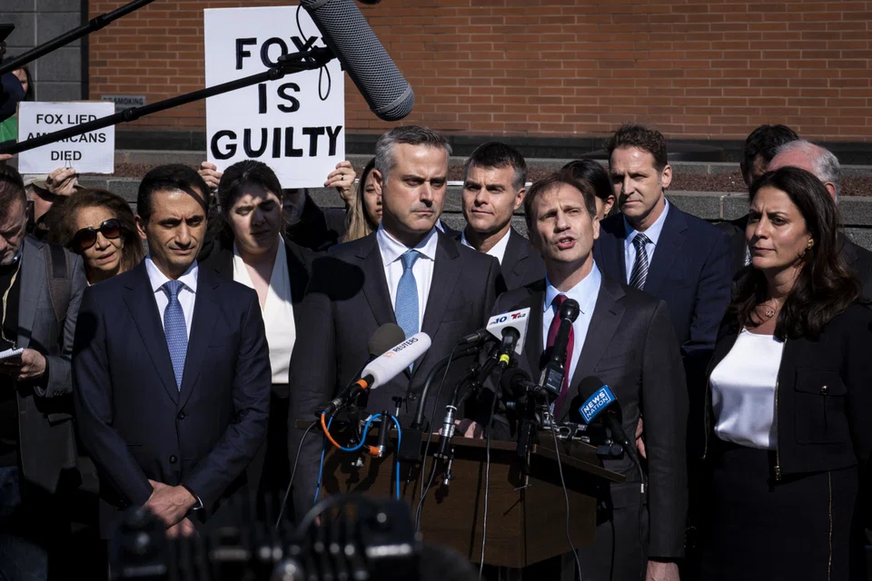 Justin Nelson, co-lead counsel for Dominion Voting Systems in its defamation lawsuits, speaks at a news conference with colleagues and John Poulo (centre) Dominion’s chief executive, following a settlement in their defamation lawsuit against Fox News at the Delaware Superior Court in Wilmington, Delaware, April 18, 2023. 