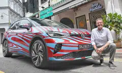 Volkswagen Group Singapore managing director Kurt Leitner with the Volkswagen ID.4 GTX electric SUV, the high-performance version of the brand's ID.4 sport utility vehicle. 