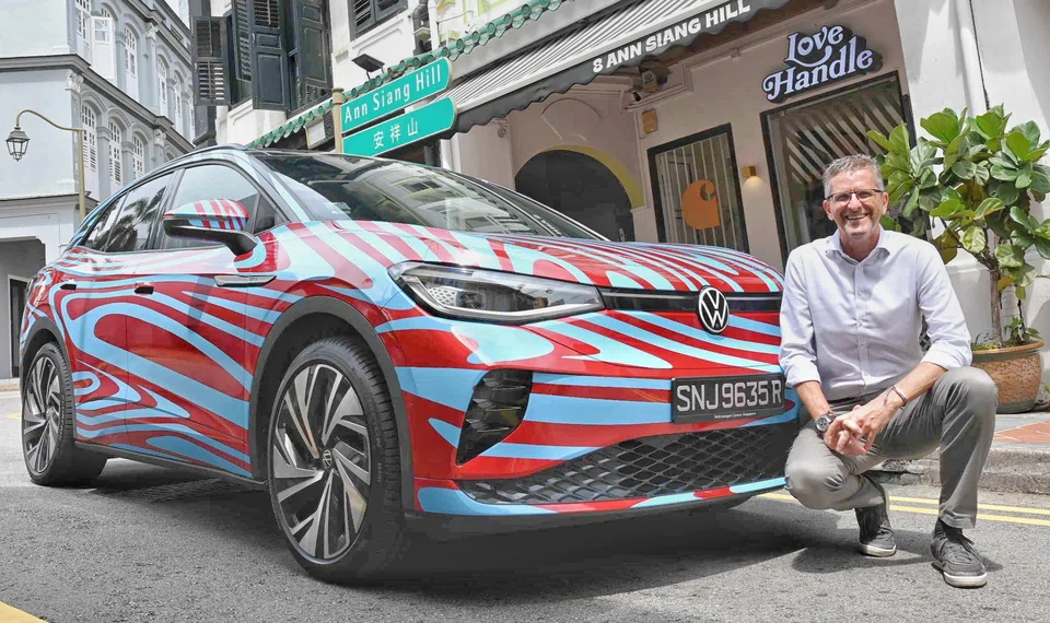 Volkswagen Group Singapore managing director Kurt Leitner with the Volkswagen ID.4 GTX electric SUV, the high-performance version of the brand's ID.4 sport utility vehicle. 
